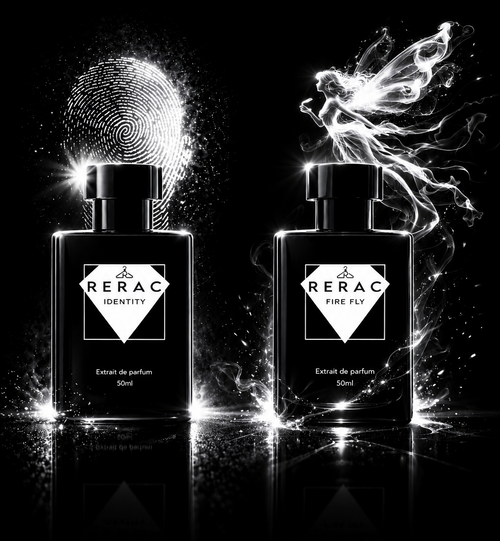 Two black RERAC perfume bottles labeled 'Density' and 'Fine Art' on a glossy black reflective surface, with dramatic white light effects and abstract smoke-like forms behind them.